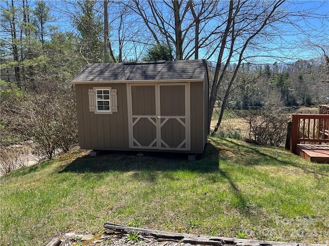 view of outdoor structure featuring a lawn