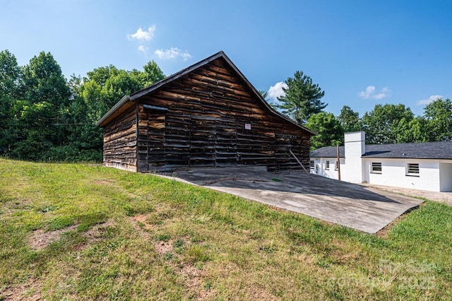 view of outdoor structure featuring a yard