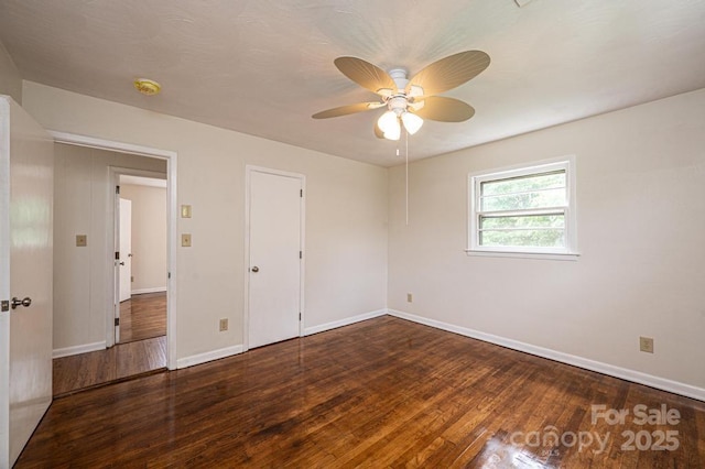 unfurnished bedroom featuring dark hardwood / wood-style floors and ceiling fan