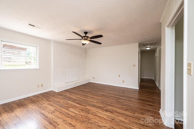 unfurnished room with dark hardwood / wood-style flooring and ceiling fan