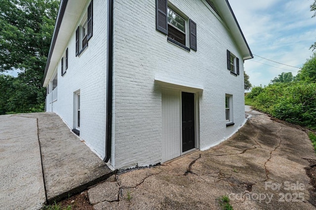 view of property exterior featuring a patio