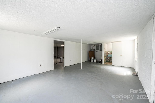 basement featuring a textured ceiling