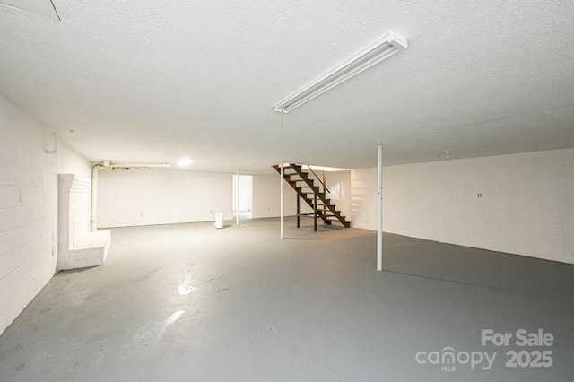 basement with a textured ceiling