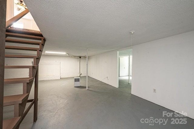 basement with a textured ceiling