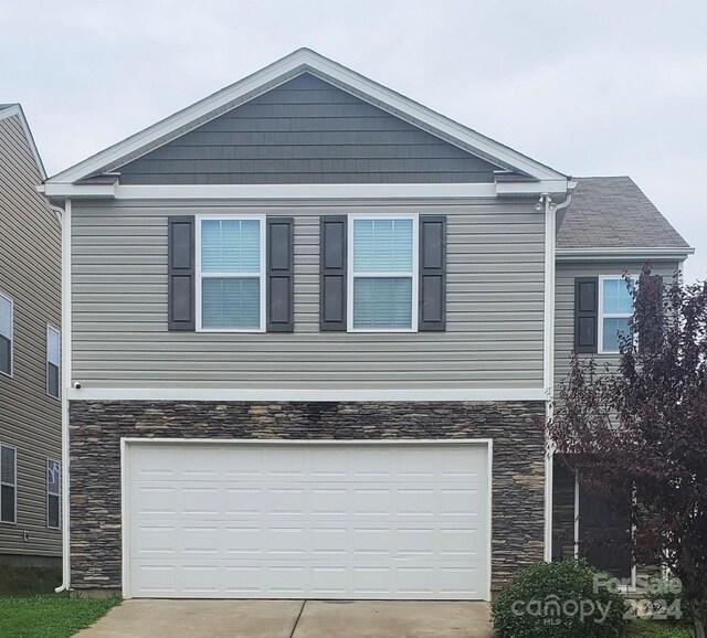 view of front of property with a garage