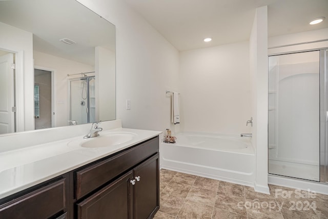 bathroom featuring independent shower and bath and vanity