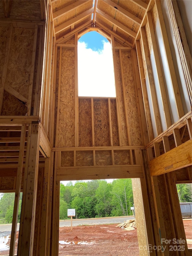 interior space featuring lofted ceiling and plenty of natural light