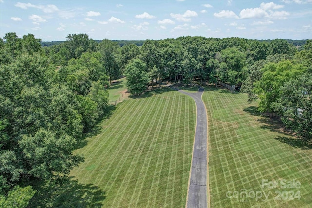 birds eye view of property with a rural view