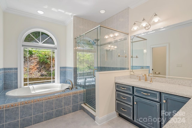 bathroom featuring vanity, shower with separate bathtub, crown molding, and tile patterned flooring