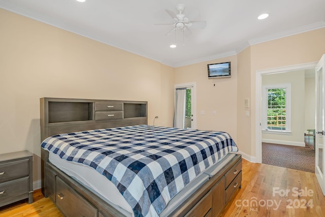 bedroom with ceiling fan, light hardwood / wood-style flooring, and crown molding