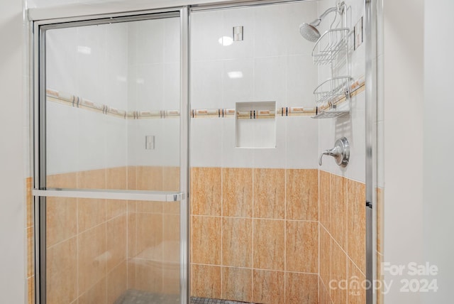 full bathroom featuring a stall shower