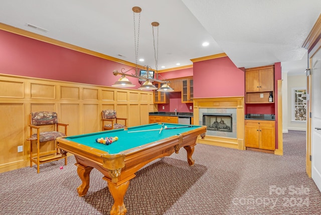 recreation room with crown molding, light colored carpet, sink, a tiled fireplace, and billiards