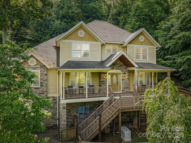 view of front of house with central AC and a porch