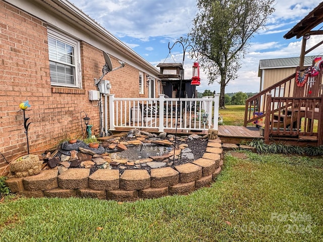 view of yard with a wooden deck