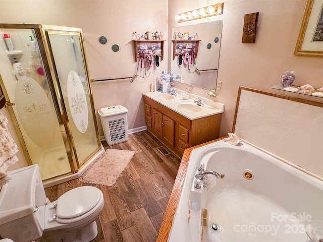 full bathroom with toilet, vanity, shower with separate bathtub, and hardwood / wood-style floors