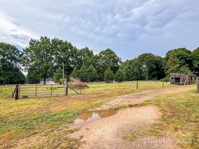 view of yard with a rural view