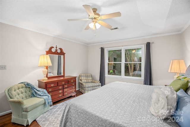 bedroom with ceiling fan, dark wood-type flooring, crown molding, and a textured ceiling