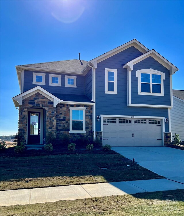 view of front of property with a garage