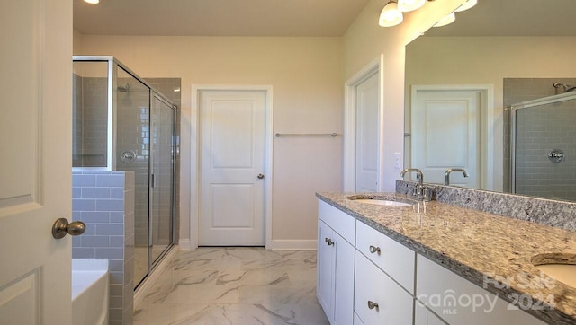 bathroom with dual vanity, tile patterned floors, and independent shower and bath