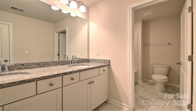 full bath featuring toilet, marble finish floor, visible vents, and a sink