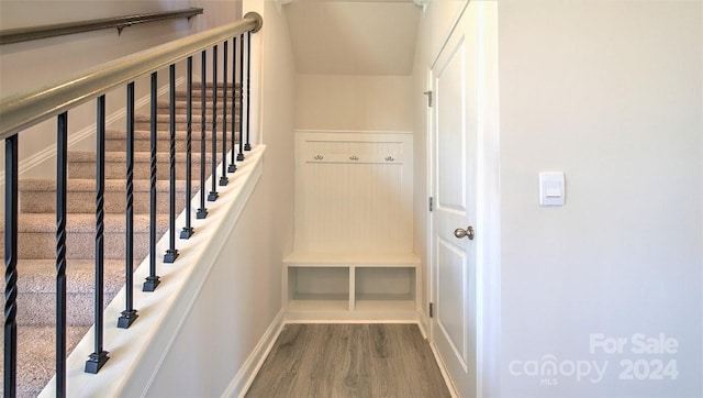 staircase with wood-type flooring