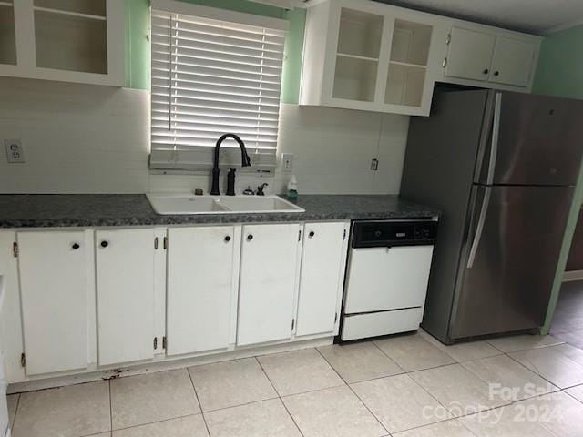 kitchen with white cabinets, dishwasher, stainless steel fridge, and sink