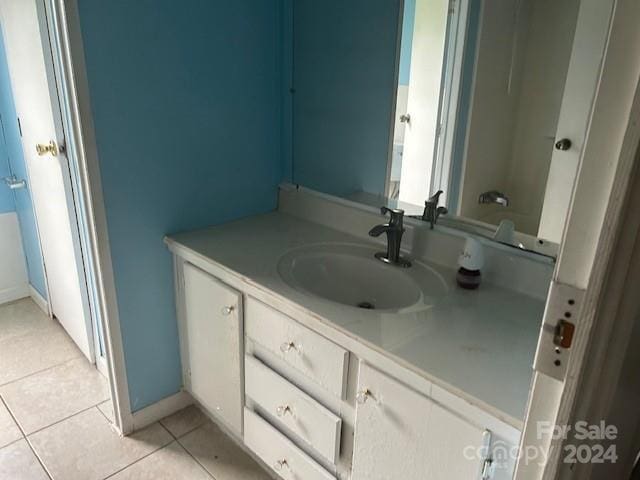 bathroom with vanity and tile patterned flooring