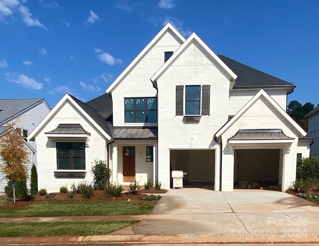 modern farmhouse featuring a garage