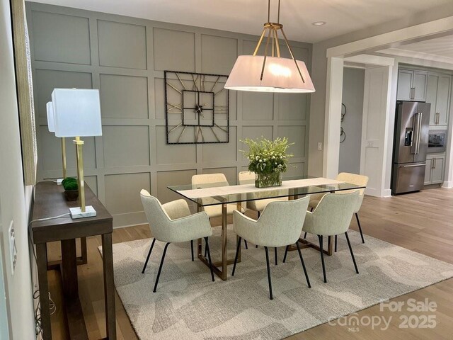 dining room with light hardwood / wood-style flooring