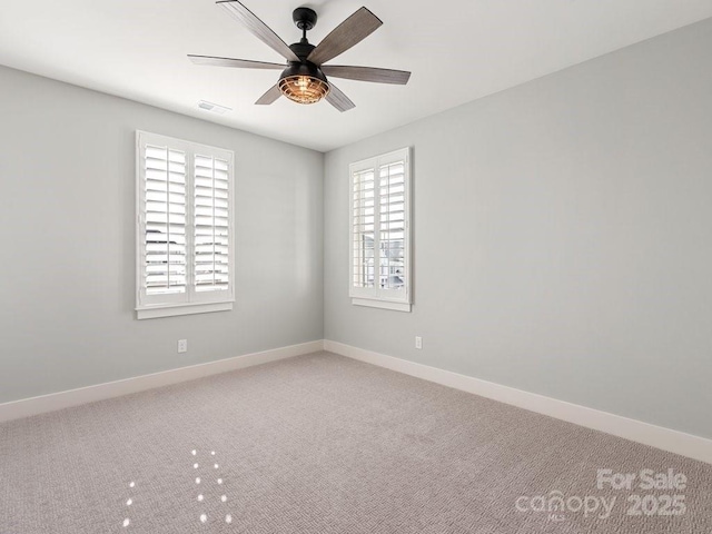 unfurnished room featuring carpet and ceiling fan