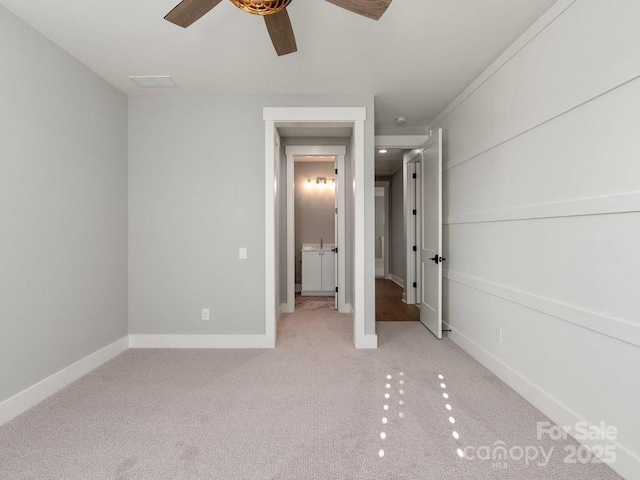 unfurnished bedroom with ceiling fan and light colored carpet