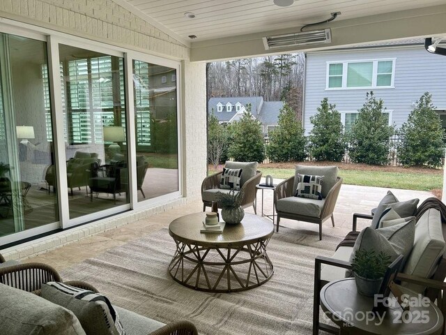 exterior space with an outdoor living space and ceiling fan