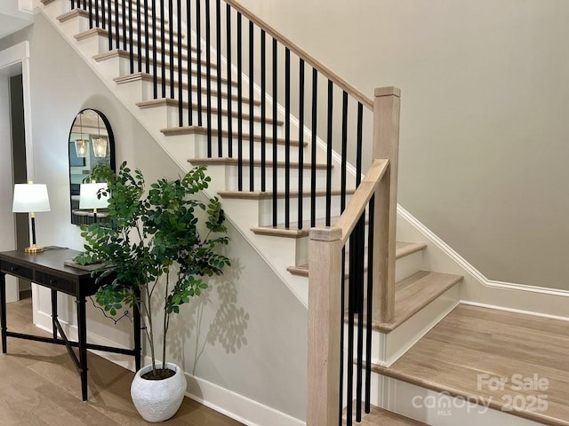 stairway with wood-type flooring