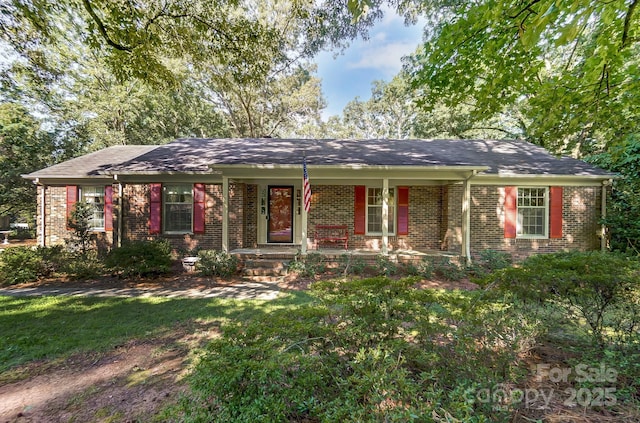 single story home with covered porch