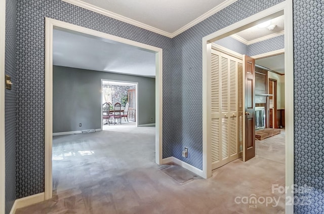 corridor featuring ornamental molding and light carpet