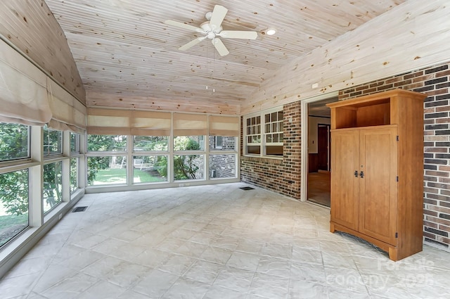 interior space with lofted ceiling, wooden ceiling, and ceiling fan