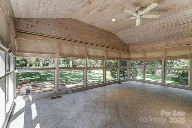 unfurnished sunroom featuring ceiling fan, vaulted ceiling, and wooden ceiling