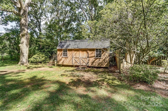 view of outdoor structure featuring a lawn