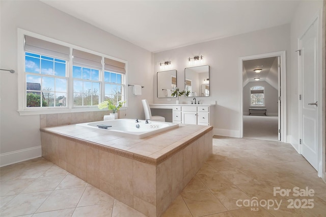 bathroom featuring tile patterned flooring and vanity