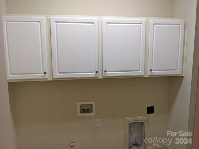 laundry area with cabinets, gas dryer hookup, hookup for a washing machine, and hookup for an electric dryer