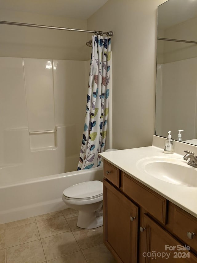 full bathroom with toilet, tile patterned floors, shower / bathtub combination with curtain, and vanity