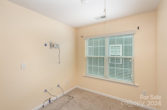 empty room featuring carpet flooring