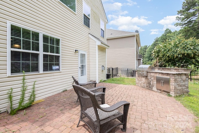 view of patio / terrace with area for grilling and an outdoor kitchen