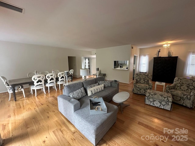 living room with light hardwood / wood-style floors