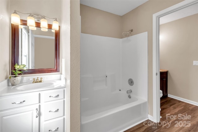 bathroom with shower / tub combination, vanity, and wood-type flooring