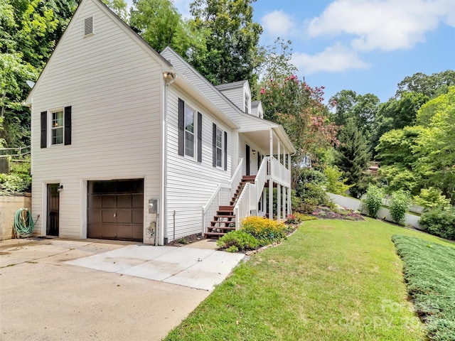 view of property exterior featuring a garage and a lawn