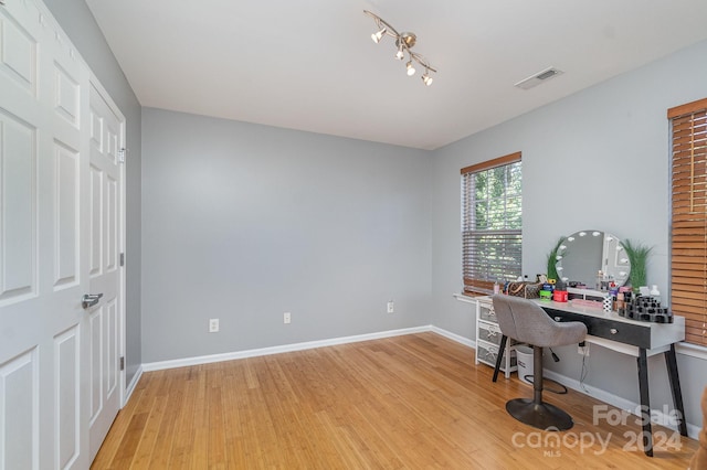 home office with light wood-type flooring