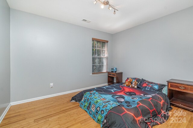 bedroom featuring hardwood / wood-style flooring