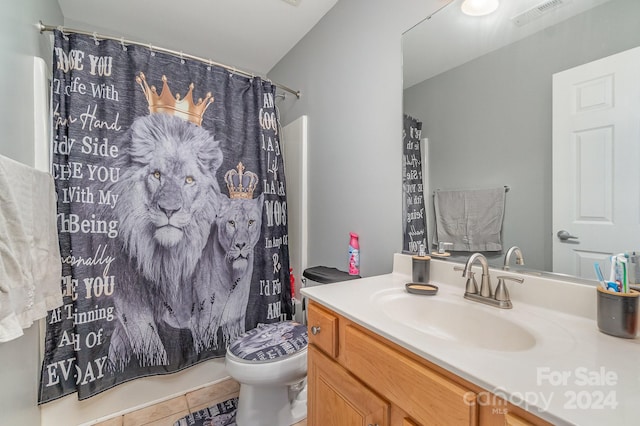 bathroom with walk in shower, vanity, toilet, and tile patterned flooring