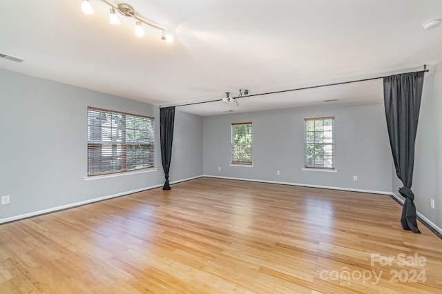 spare room featuring light wood-type flooring